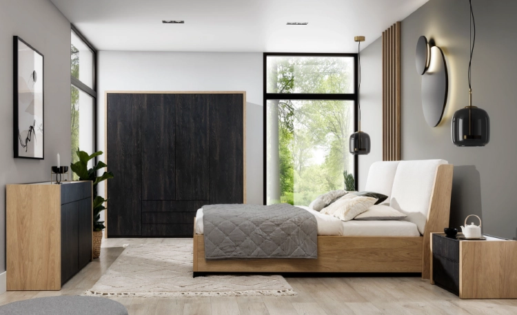Łóżko MODELLO z tapicerowanym zagłówkiem New Elegance. Łóżko z miękkimi poduchami na odchylonym wezgłowiu, w tkaninie Positano o strukturze delikatnej plecionki z kolekcji Davisa.