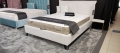 Łóżko SIMONE ONE tapicerowane light z miękkim zagłówkiem oraz pojemnikiem na pościel / schowkiem  - Bed Design w Świat Sypialni Piaseczno rozmiary 140/200; 160/200 ; 180/200 ; 200/200 ; 140x/200 ; 160x200 ; 180x200 ; 200x200